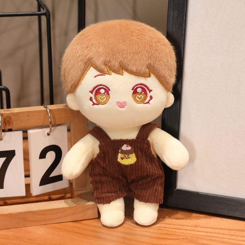 Brown-haired human character plush with embroidered face and outfit details